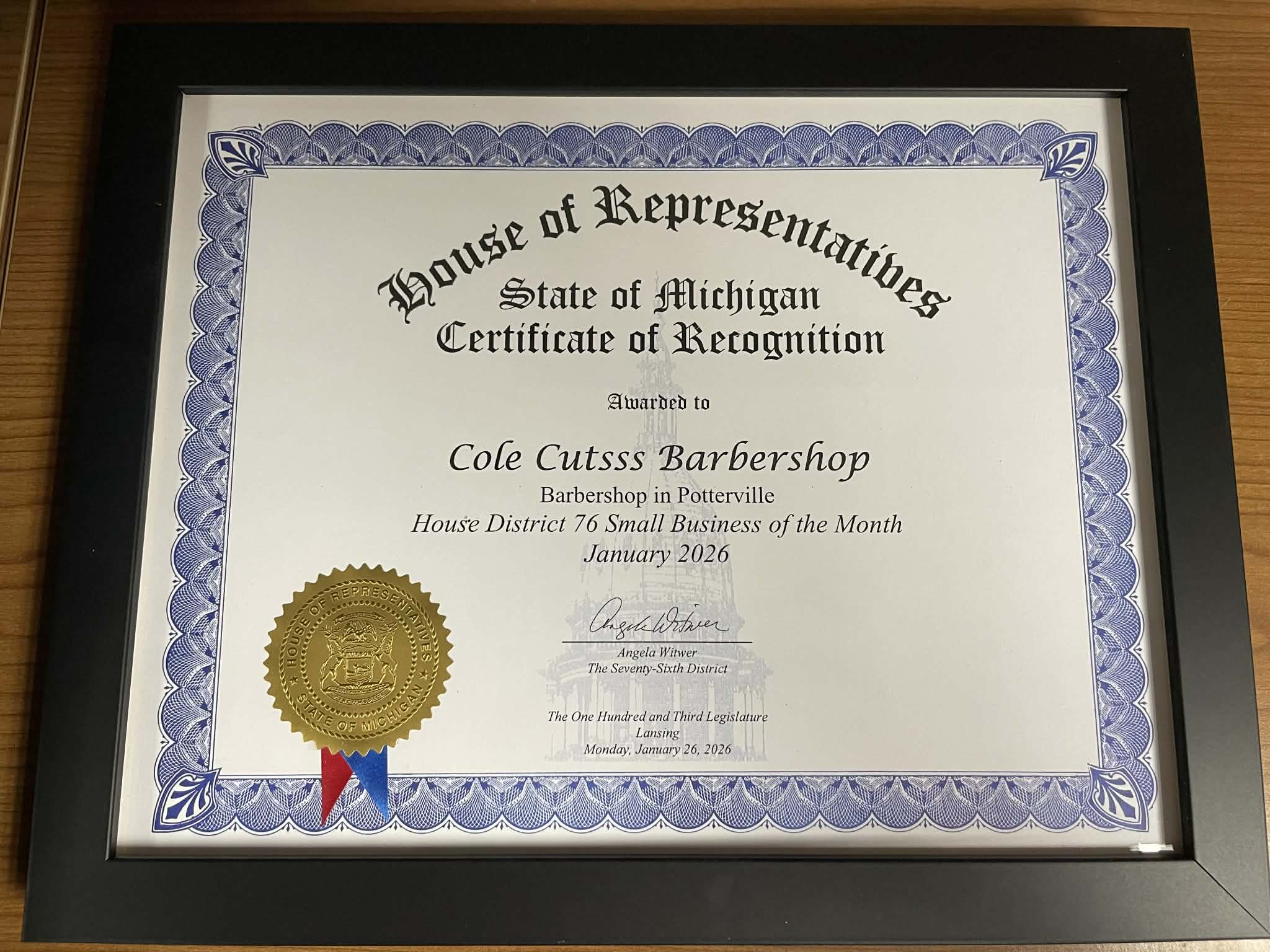 Cole Cutsss Barbershop Small Business of the Month certificate from Michigan House of Representatives